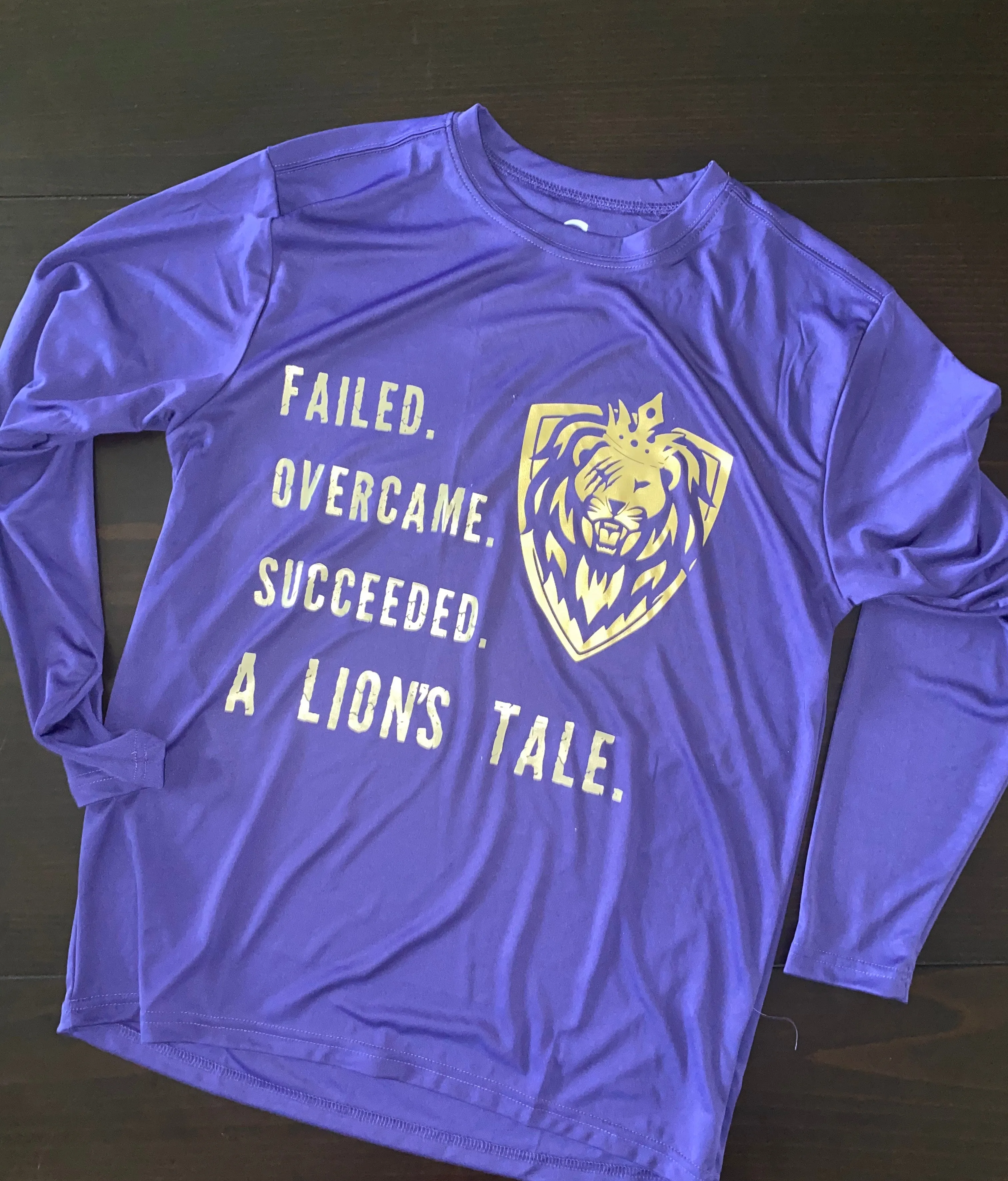 Men's "A Lion's Tale"  Performance Long Sleeve Tee